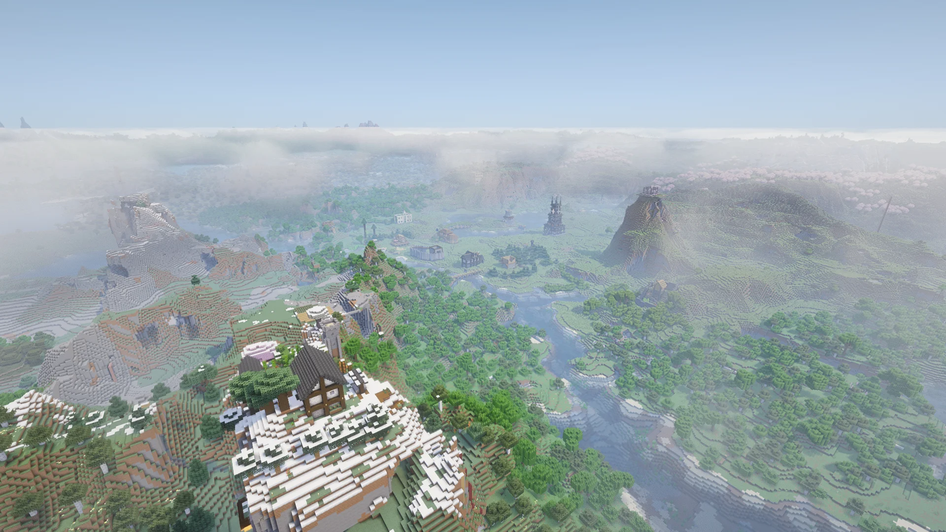 A wide aerial view of a Fixed by Design survival world, with rivers, forests, mountains and player-built landmarks.
